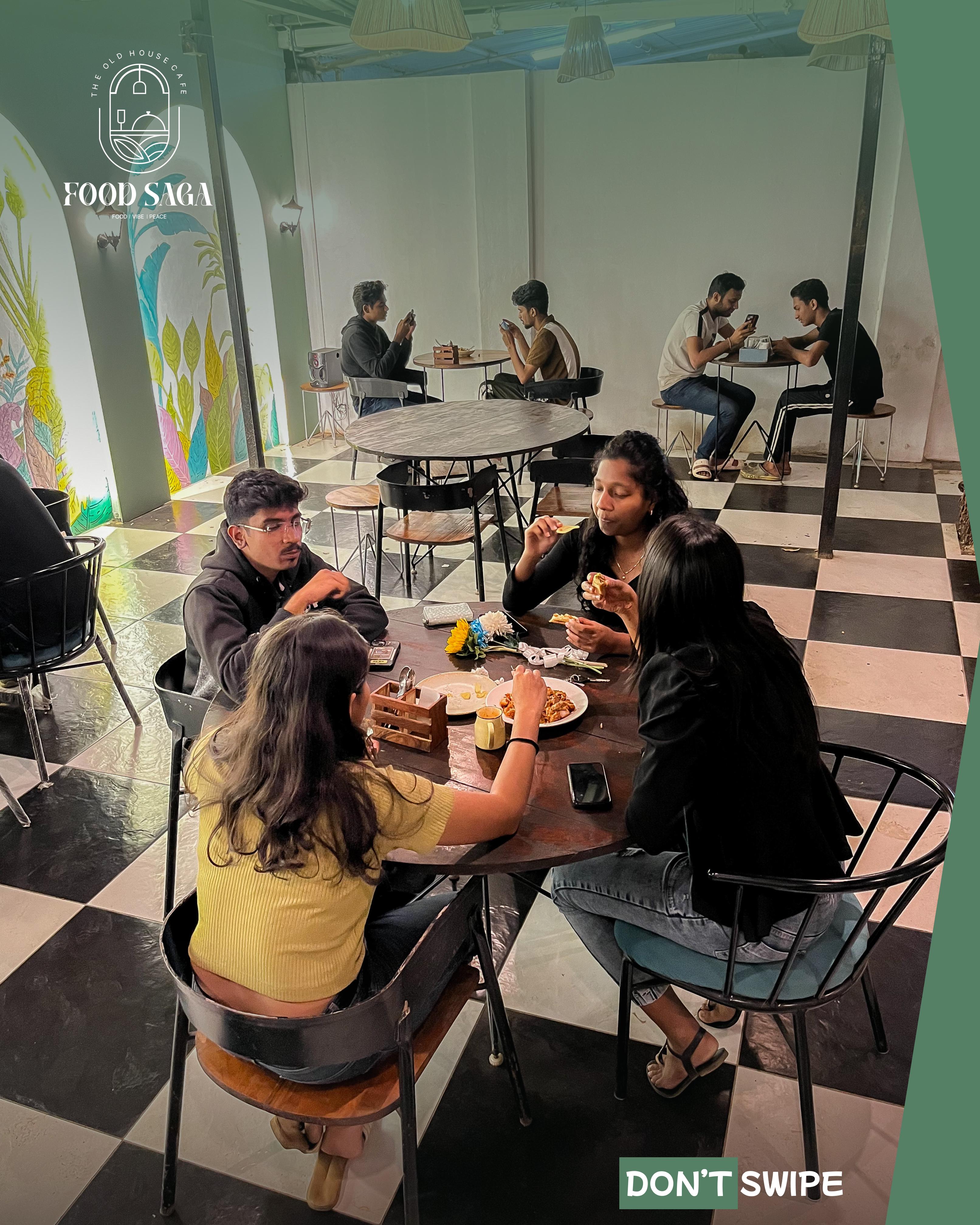 Food Saga café interior with diners enjoying meals